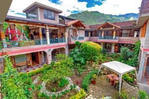 an aerial view of a house with a garden at La Floresta Hotel in Baños