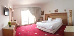 Gulta vai gultas numurā naktsmītnē Regency Pyramids Hotel