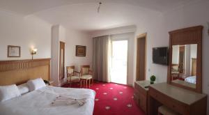 Gulta vai gultas numurā naktsmītnē Regency Pyramids Hotel