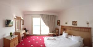 Gulta vai gultas numurā naktsmītnē Regency Pyramids Hotel