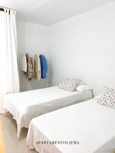 Voodi või voodid majutusasutuse Apartamento Jema, a un paso de la playa toas +6 fotot