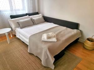 מיטה או מיטות בחדר ב-Apartamento Vicario Toledo