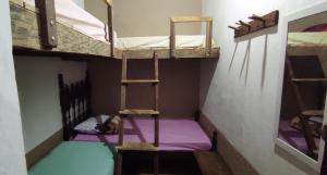 Cama ou camas em um quarto em Hostel Mucugê