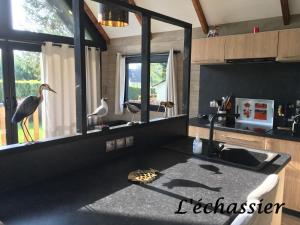 Μια τηλεόραση ή/και κέντρο ψυχαγωγίας στο L'échassier +10 φωτογραφίες
