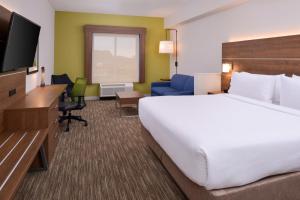 a hotel room with a large bed and a television at Holiday Inn Express - Nashville South - Spring Hill, an IHG Hotel in Spring Hill