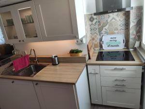 a kitchen with a sink and a counter top at Luminoso y acogedor apartamento junto a la Macarena de Sevilla in Seville