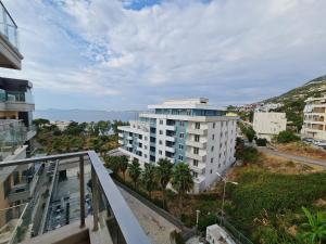 an apartment balcony with a view of the ocean at Holiday One Bedroom Sea View Apartment Vlore in Vlorë