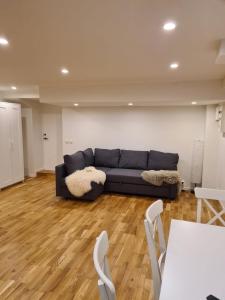 a living room with a couch and a table at Pearl of Duved in Duved