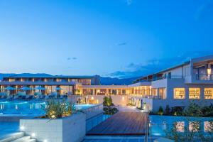 a view of the exterior of a hotel at night at Horizon Blu Boutique Hotel in Kalamata