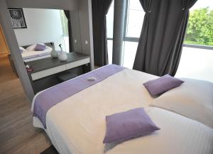 Posteľ alebo postele v izbe v ubytovaní Apartments & Rooms Lavandula Exclusive