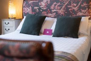 Letto o letti in una camera di Emmet Hotel