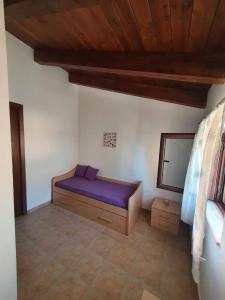 A bed or beds in a room at Gabbiano Jonathan