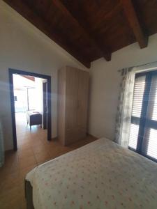 A bed or beds in a room at Gabbiano Jonathan