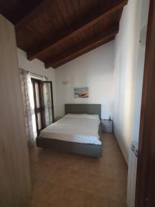 A bed or beds in a room at Gabbiano Jonathan