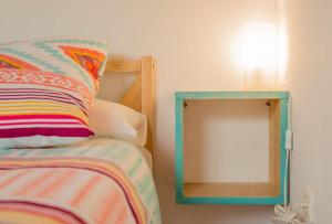a bedroom with a bed and a mirror at CASA LUNA en Playa de El PALMAR in El Palmar +15 photos