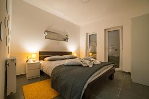 Ένα ή περισσότερα κρεβάτια σε δωμάτιο στο Relax zone - Apartmani La ISA +63 φωτογραφίες
