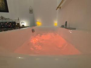 a bath tub filled with red liquid at Il Sitarein in Bologna +73 photos