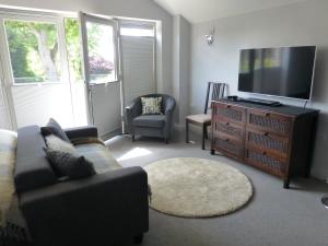 A seating area at The Stone Barn at Stratton House 