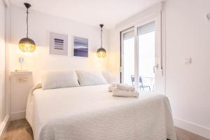 Posteľ alebo postele v izbe v ubytovaní Unika homes Juan Rabadán