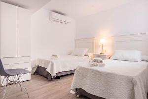 Posteľ alebo postele v izbe v ubytovaní Unika homes Juan Rabadán