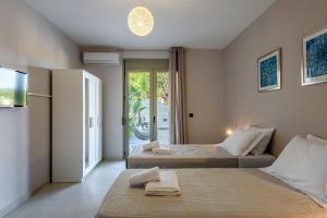 Postel nebo postele na pokoji v ubytování Villa Vasiliki