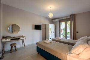 Postel nebo postele na pokoji v ubytování Villa Vasiliki