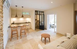 a kitchen and living room with a couch and a table at Amazing Home In Le Tignet in Le Tignet