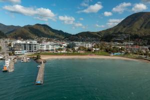 an aerial view of a beach with boats in the water at Oxleys Penthouse 506 in Picton