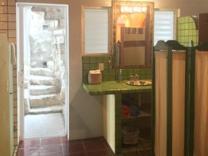 a bathroom with a sink and a mirror at Villas Jardin Del Mar in Cruz de Huanacaxtle