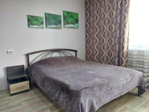 
Кровать или кровати в номере Комарова 9Б
