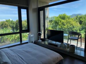 Postel nebo postele na pokoji v ubytování One Piece B&B