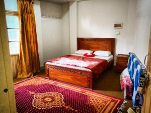 Ліжко або ліжка в номері Tour De Swat