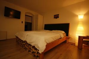 A bed or beds in a room at Miniponyhof Biohof Almbauer