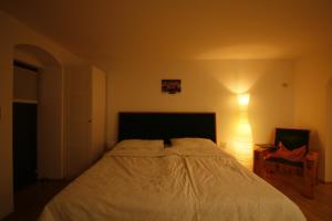 A bed or beds in a room at Miniponyhof Biohof Almbauer