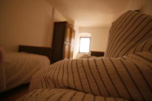 A bed or beds in a room at Miniponyhof Biohof Almbauer