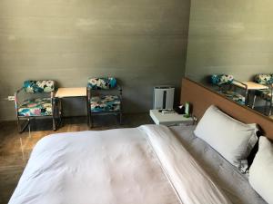 Postel nebo postele na pokoji v ubytování One Piece B&B