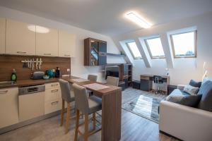 A kitchen or kitchenette at Zsuka apartman free parking