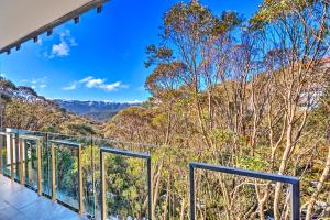 a view of the mountains from the balcony of a house at Snow Ski Apartments 25 in Falls Creek