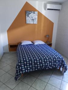 Postel nebo postele na pokoji v ubytování Location saisonnière Les Hirondelles - Manapany