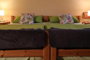 a room with two beds and a couch at Ferienhof Seeber in Weikersheim