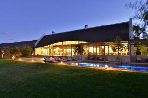 a large house with a pool in the yard at Sanbona Wildlife Reserve in Barrydale