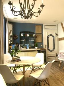a dining room with a table and chairs at Pension Altstadt Mönch unser Kleinod in top Lage direkt in der Altstadt incl Frühstück in Stralsund +24 photos