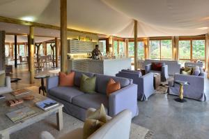 a large living room with couches and a bar at Sanbona Wildlife Reserve in Barrydale