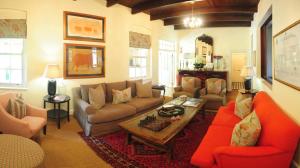 a living room with couches and a table at Sanbona Wildlife Reserve in Barrydale