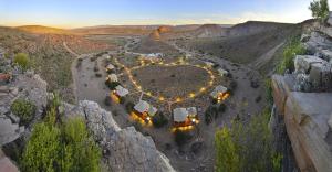 an aerial view of a hotel in the middle of a canyon at Sanbona Wildlife Reserve in Barrydale