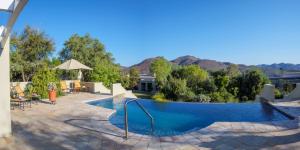 a swimming pool with mountains in the background at Sanbona Wildlife Reserve in Barrydale