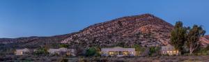 a house in front of a mountain at Sanbona Wildlife Reserve in Barrydale