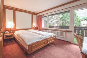 Postel nebo postele na pokoji v ubytování Antares Hotel
