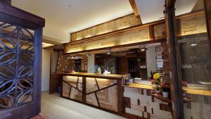 a kitchen with wooden cabinets and a counter top at Chin-Be in Beigan