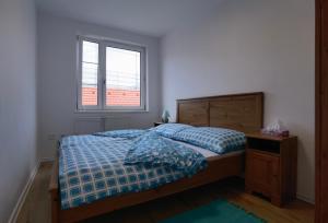 Postel nebo postele na pokoji v ubytování Apartmán Športová